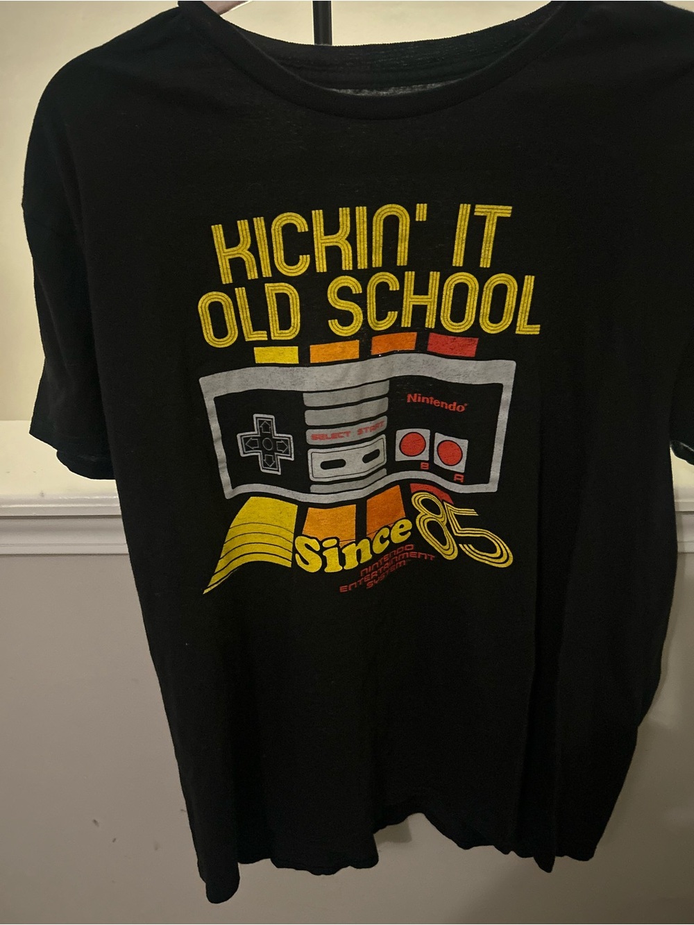Fifth Sun Nintendo Classic NES "Kickin' It Old School Since '85" T-Shirt.
Descr